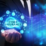 Business, Technology, Internet and network concept. Young businessman working on a virtual screen of the future and sees the inscription: Cyber insurance
